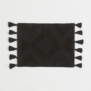 New H&M Home Black Tasselled bath mat Size: 18X24.